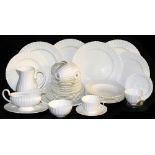A Royal Worcester porcelain part tea and dinner service, of white glazed fluted form, printed marks,