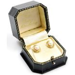 A pair of 18ct gold circular earrings, each set with cultured pearl on twist design outer border wit