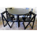 A Team Sieben ebonised circular wooden dining table, with one additional leaf, 73cm high, 109cm wide