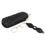 A pair of Victorian tortoiseshell and gold plated lorgnettes, in a black bead work glasses case.