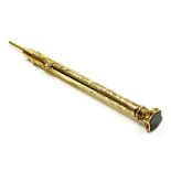 A Victorian gold plated sliding pen and pencil, with bloodstone set shield shaped capital terminal.