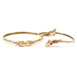 Two 9ct gold bangles, comprising a dolphin hinged bangle and a ball design torc bangle, 5cm and 6cm