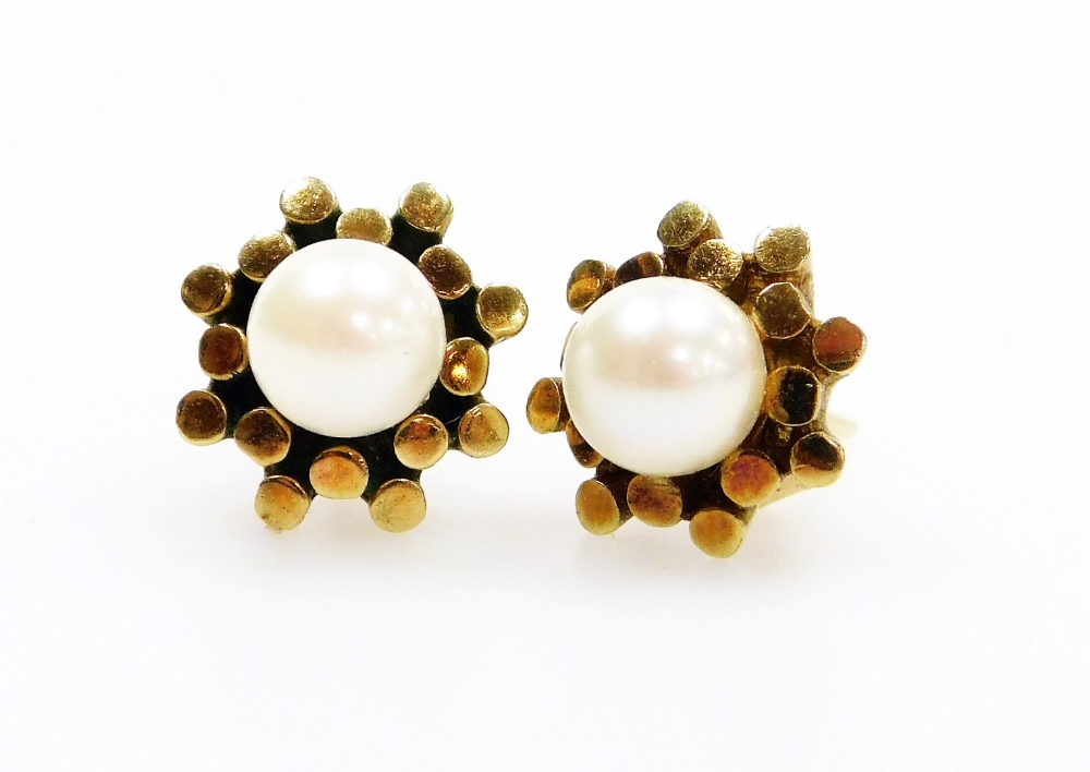 A pair of 9ct gold cultured pearl earrings, with abstract floral design and central cultured pearl w