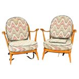 A pair of Ercol model 203 light elm and beech Windsor armchairs, with patterned cushion seats and ba