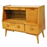 A G plan 1950s light oak sideboard, with one long fitted drawer and a drop down drinks cabinet, flan