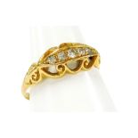 An 18ct gold and diamond gypsy ring, the marquise panel set five tiny diamonds and outer scroll deta