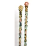 Two 19thC Nailsea glass walking canes, of spiral fluted form, containing intervals of various colour