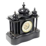 A Victorian black slate mantel clock, the brass circular dial with white enamel chapter ring, bearin