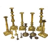 Georgian and later brass candlesticks, pairs and singles. (1 tray)