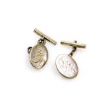 A pair of silver cufflinks, with oval shield bearing the initials TLH, with chain link and bar back,