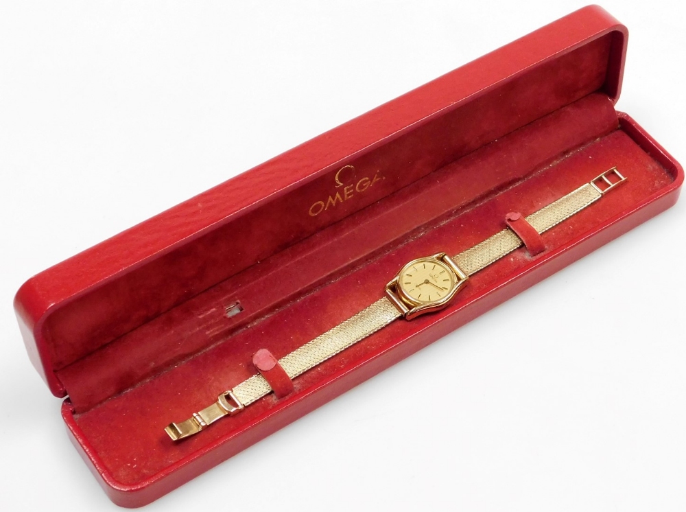 An Omega De Ville lady's 9ct gold wristwatch, with small circular watch head, on a bark effect type - Image 2 of 2