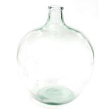 A green glass carboy, 45cm diameter.