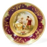 A 19thC Bohemian porcelain dish, Cupid a Cephisa, after Angelica Kauffman, with hand painted decorat
