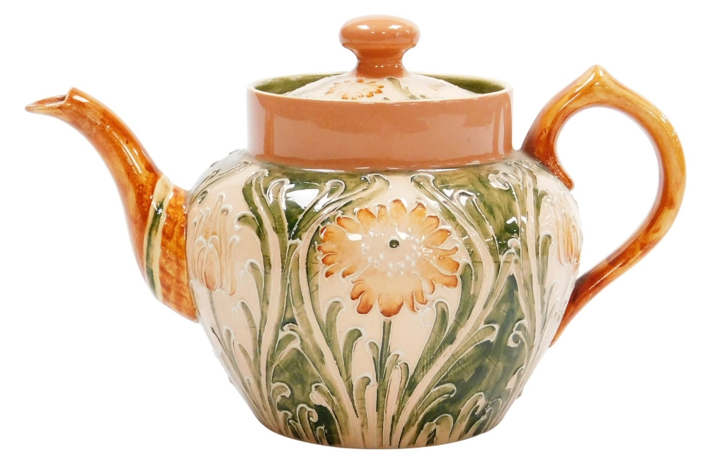 A Moorcroft Macintyre and Co Florian ware bachelor's teapot and cover, of bullet shaped form, decora