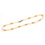 A coral and cultured pearl necklace, on a knotted string strand with a 9ct gold clasp, 38cm long, 15