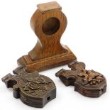 Two late 19th/early 20thC black forest carved lindenwood pocket watch stands, each carved with leave