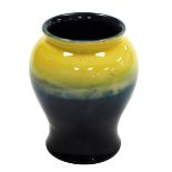 A Moorcroft pottery vase, of baluster form, in graduated yellow and blue glaze, impressed marks and