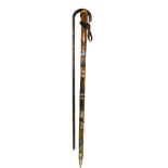 An Alpine mountain climbing stick, bearing badges for Neuschwanstein, Switzerland, Hohenschwangau an