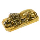 A Victorian loaded brass paperweight, cast as a recumbent lion, on a canted rectangular base, 16.5cm