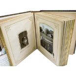 A 19thC leather bound photograph album, containing Victorian and later photographs, with brass clasp