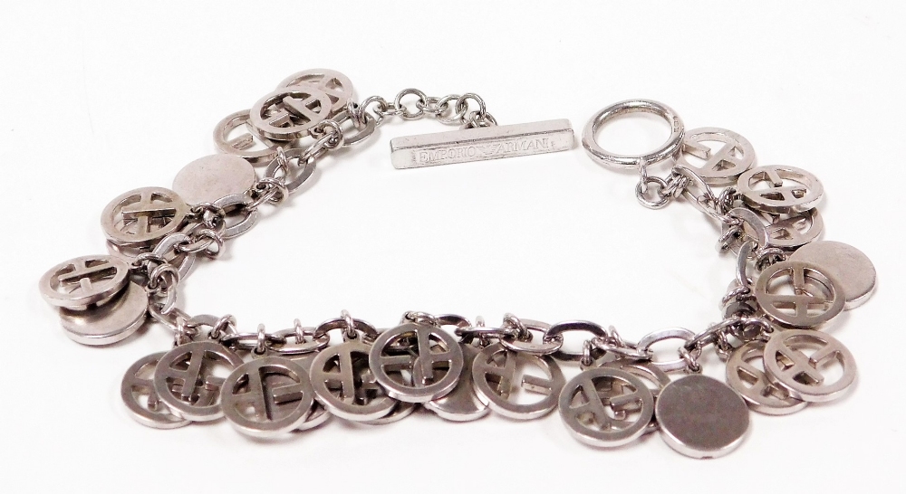 An Emporio Armani bracelet, with various circular links, and a T bar clasp, 19cm long, white metal s