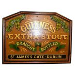A Guinness carved wood and plaster advertising sign, extra stout and draught bottled, St James's Gat