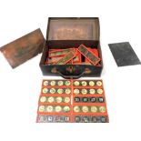 Victorian magic lantern slides, in a leather case, together with three copper engraving plates. (a q