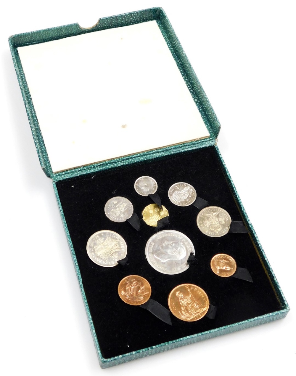 A Festival of Britain 1951 coin set, ten coins, crown to half penny, in a gilt tooled green faux sha