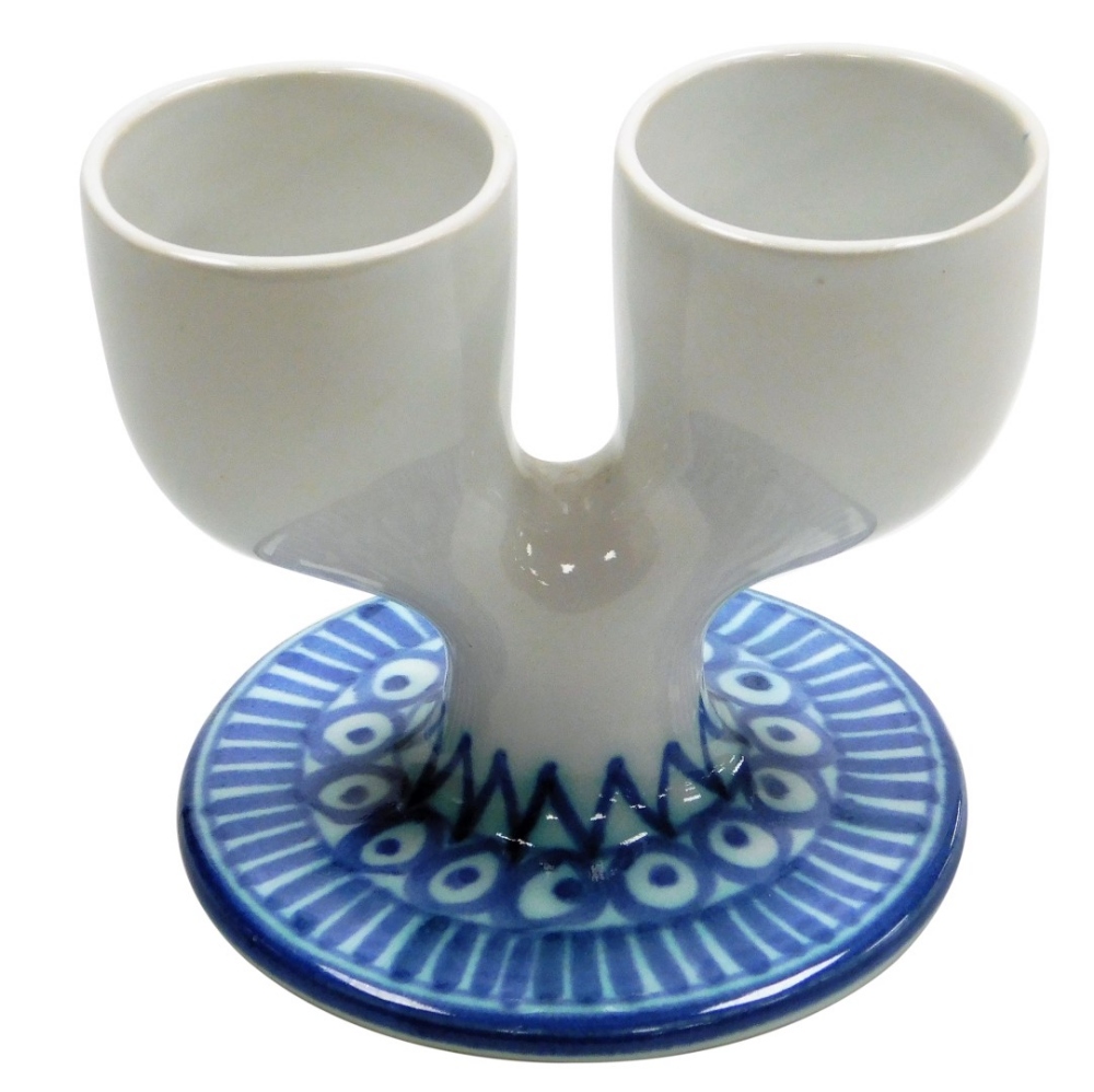A Troika Pottery double egg cup, decorated with a two tone blue pattern of lines, circles, dots and