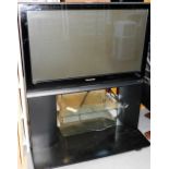 A Panasonic Viera 37" flat screen television, TH-37PX70B, on stand, with lead lacking remote. Lots