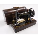 A cased Singer sewing machine.