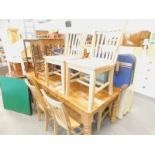 A set of eight pale beech kitchen type chairs, each with slatted back.