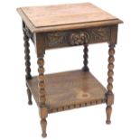 A late 19th/early 20thC oak side table, the rectangular top with a moulded edge above a carved