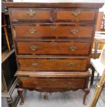 A 19thC oak and mahogany cross banded secretaire chest on stand, the top with a moulded cornice