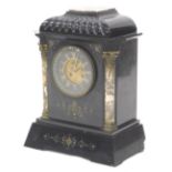 A French black slate and marble mantel clock, with a domed top, the dial with gilt Roman numerals