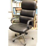 A Staples chrome and black leatherette office chair.