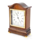 A Comitti of London mantel clock, in shaped mahogany case, with 9cm wide Roman Numeric Arabic dial