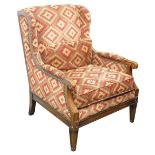 A Wrangler Home mahogany armchair in 18thC style, upholstered in carpet style fabric with studded