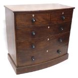 A Victorian mahogany and ebony strung bow fronted chest of drawers, the top with a cross banded