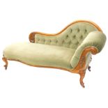 A Victorian walnut chaise longue, with a show frame a green upholstered buttoned and padded back,