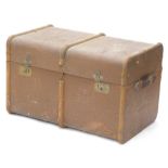 A canvas and wooden two handled travelling trunk, 76cm wide.