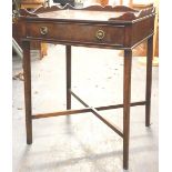 A mahogany occasional table, the rectangular top with a raised gallery above a frieze drawer on