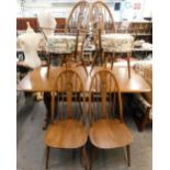 An Ercol elm rectangular dining table, with rounded corners on end supports, 74cm high, the top 83cm