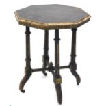 A Victorian ebonised and parcel gilt Aesthetic movement occasional table, the octagonal top with a