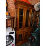 A reproduction dining room display cabinet, with cupboard base.