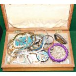 A wooden jewellery box and contents, comprising bangles, faux pearl necklaces, earrings, pendants, e