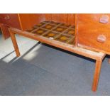 A mid century teak coffee table, with green and yellow inlaid tile top.