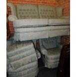 A four piece suite, upholstered in green brocade fabric. The upholstery in this lot does not comply