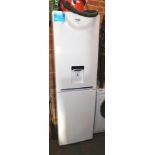 A BEKO fridge freezer, with water dispenser, model CFG3582DW.