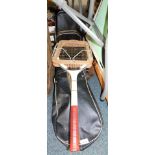 A set of vintage golf clubs and carry case, and a Dunlop Slazenger tennis racket.